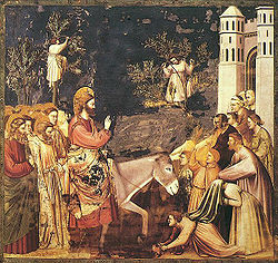 Jesus rider in i Jerusalem på en åsna på palmsöndagen. Fresk av Giotto